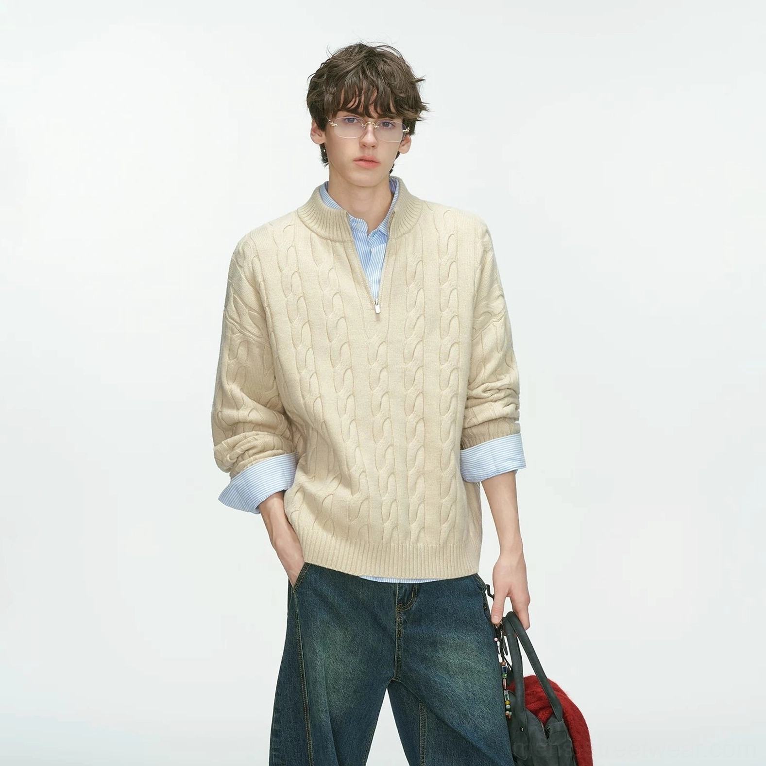 Contemporary cable-knit half-zip sweater with structured collar and relaxed silhouette for modern mens streetwear