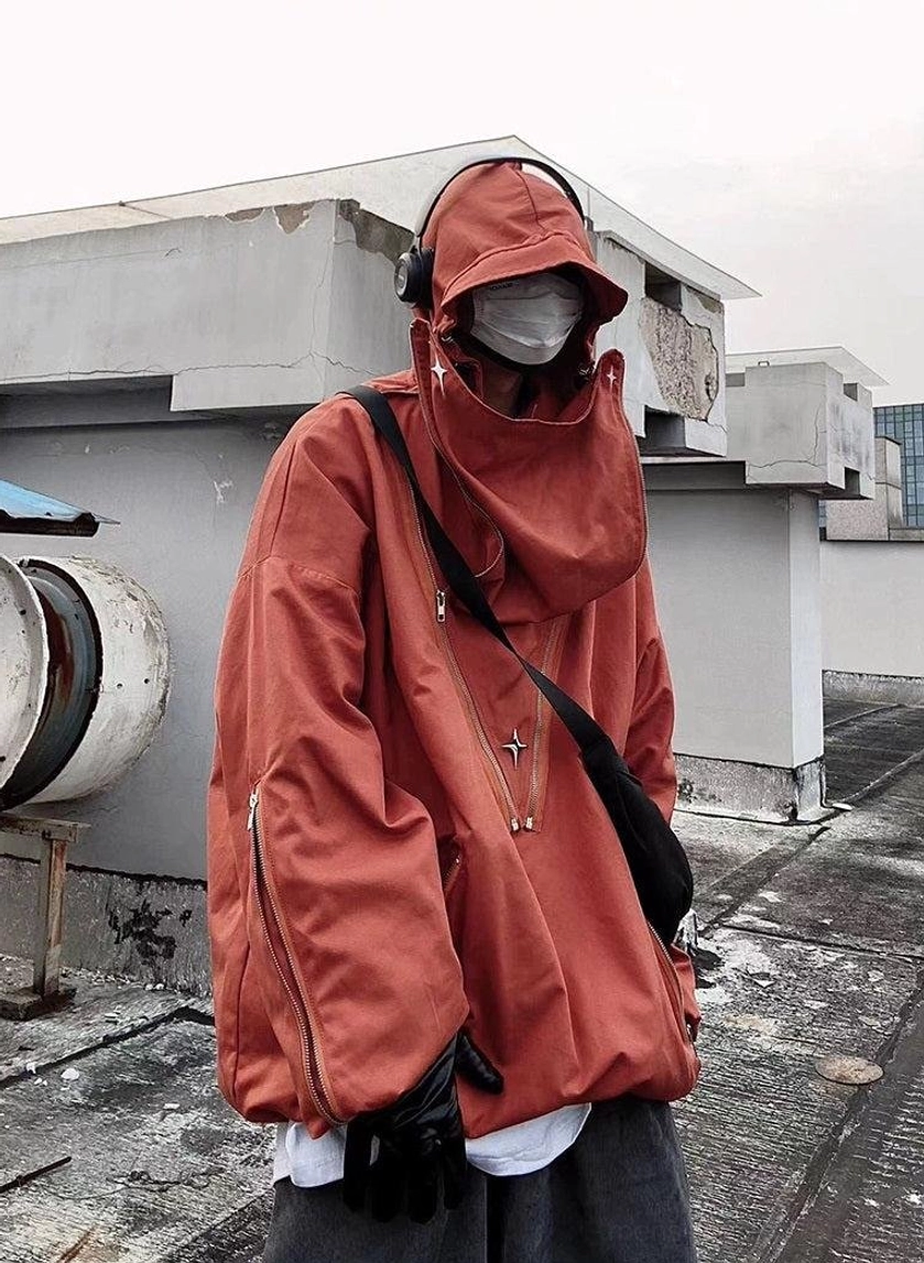 Contemporary hooded tactical jacket for streetwear outfits with relaxed fit, practical storage, and adjustable silhouette