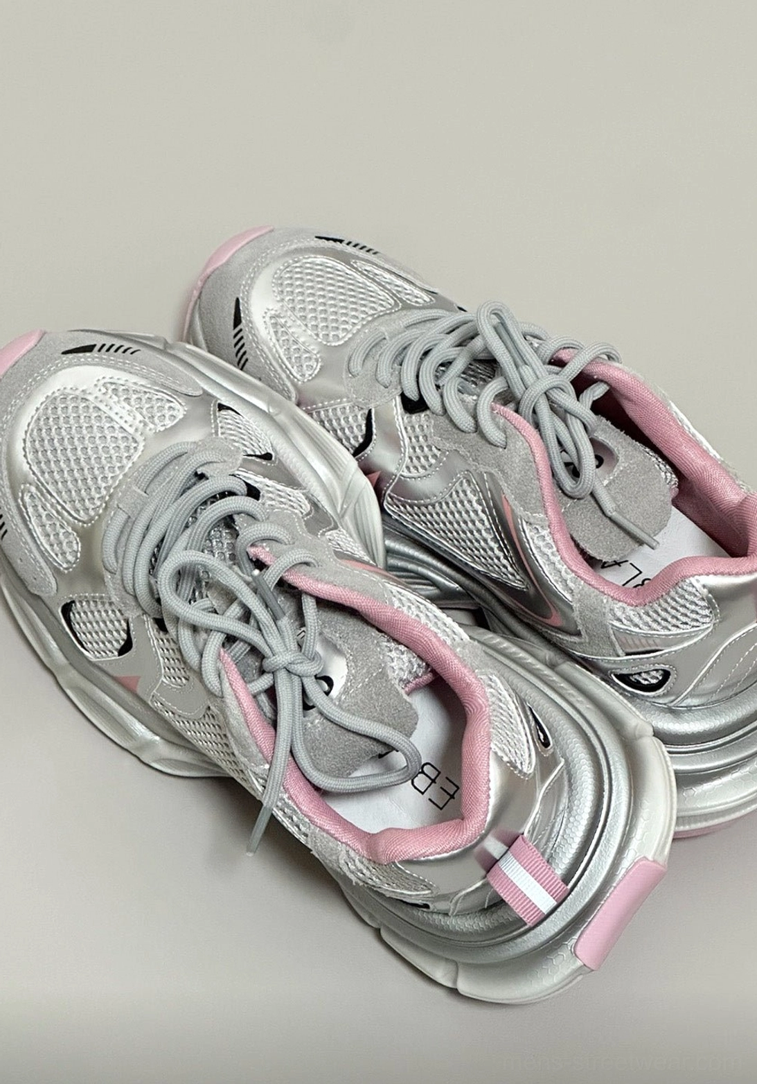 Contemporary Korean fashion runner sneakers in a chunky low-top silhouette with breathable mesh and reflective accents