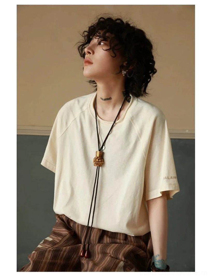 Contemporary Korean style cotton T-shirt with raglan sleeves, clean solid-color body, and relaxed proportions