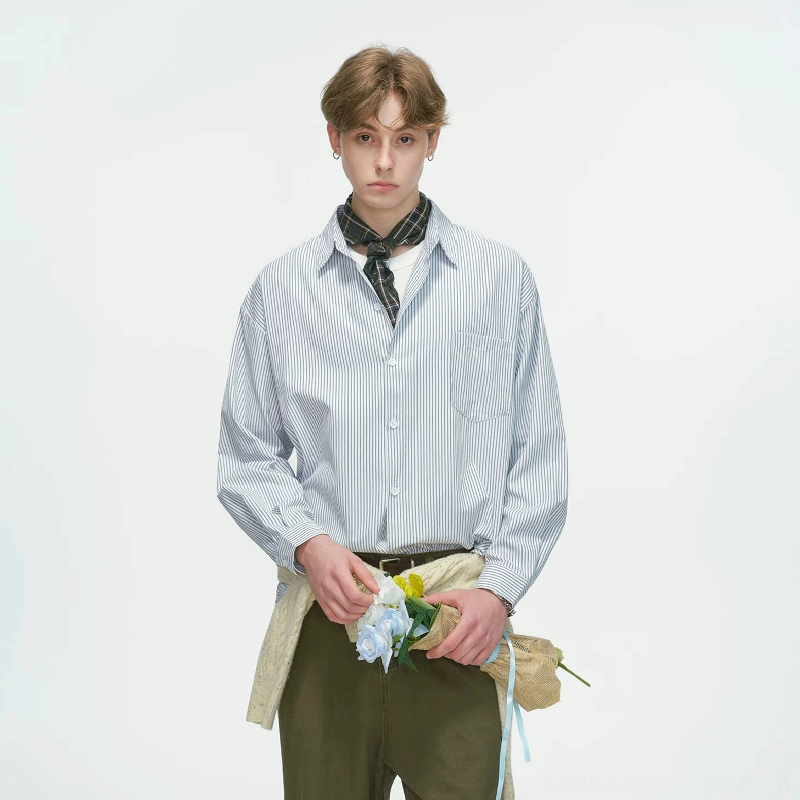 Contemporary striped overshirt for men with dropped shoulders, extended hem, lightweight layering design, and urban casual styling