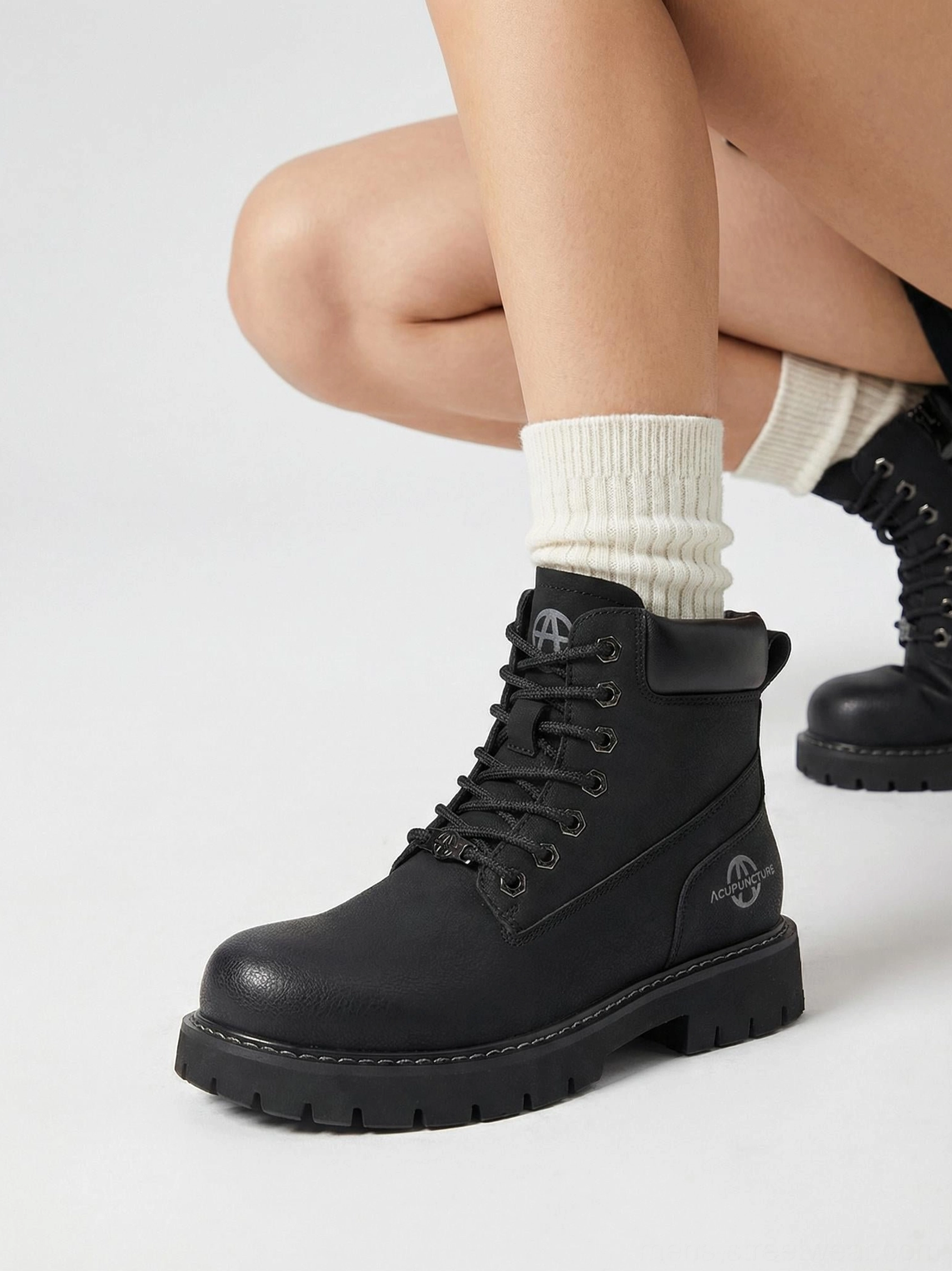 Contemporary zip-front lug sole ankle boots with classic workwear influence and urban styling