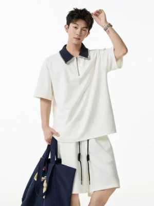 Off-white contrast collar quarter-zip streetwear shorts set with relaxed drop-shoulder top and matching drawstring shorts on male model