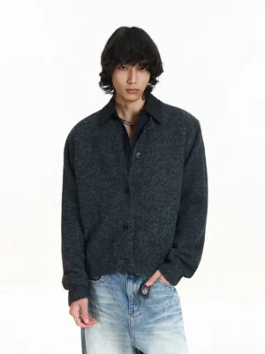 Gray soft knit cardigan with black contrast polo collar styled with light blue jeans in a clean streetwear studio look