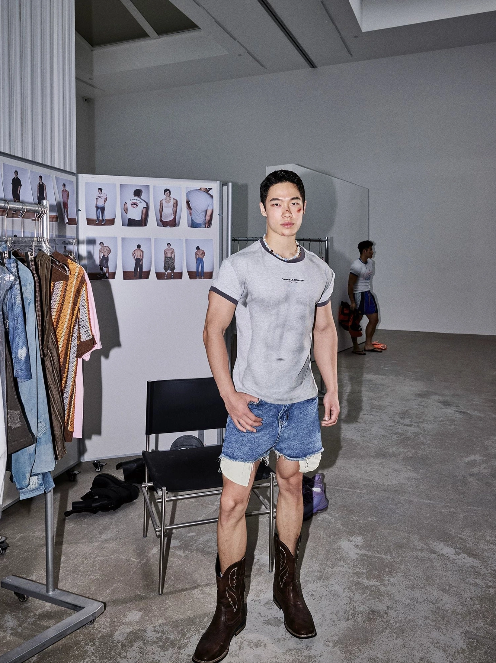Full body front view of slim relaxed contrast ringer tee and denim shorts in an East Asian street fashion outfit