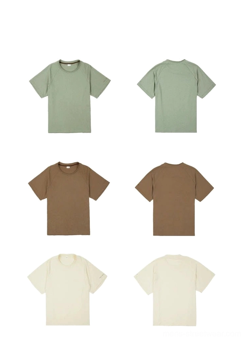 Cotton streetwear raglan tee designed with fluid shoulder lines, solid muted colors, and relaxed everyday comfort