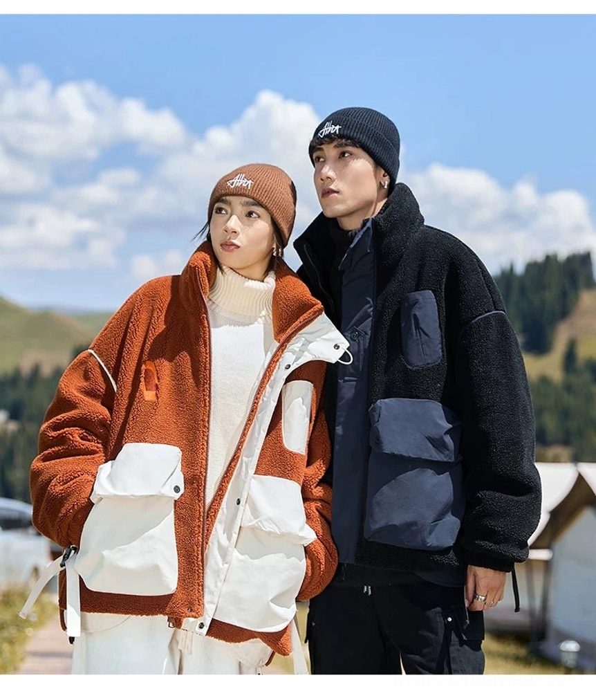 Couple styling coordinated sherpa winter jackets with knit beanies against a pine forest and mountain landscape