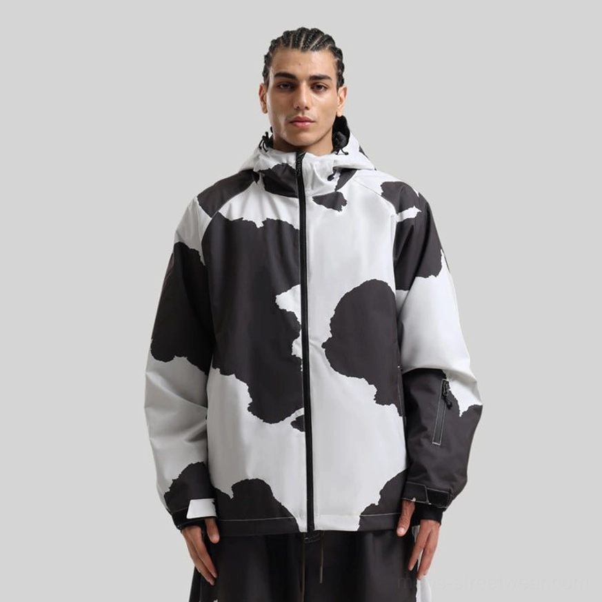 Cow print hooded ski shell jacket shown on a male model in full front view with matching statement snowboard styling