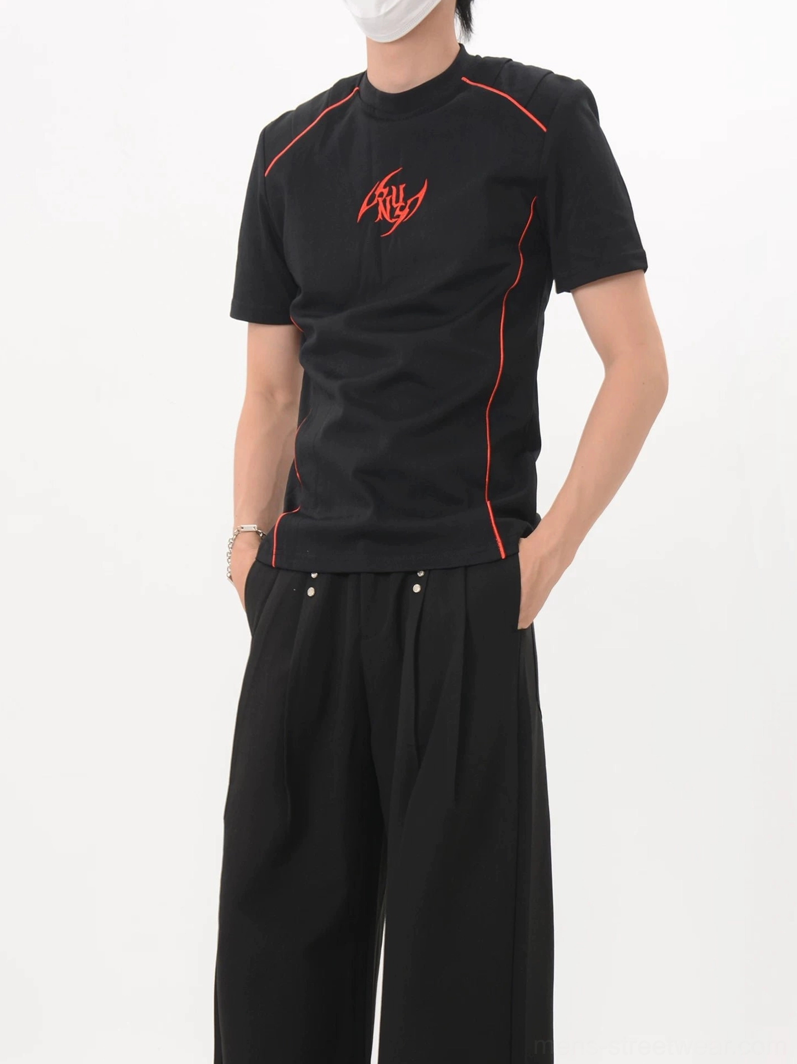 Black Crimson Circuit slim-fit racing T-shirt shown from a front three-quarter view with red contrast piping and chest emblem