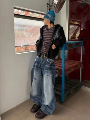 Model wearing crimson Jin Yi Wei embossed low-top sneakers with a retro East Asian streetwear outfit in a full side view
