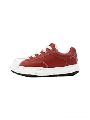 Crimson red shell-toe court sneaker shown from the side with a white molded toe, contrast laces, star heel embroidery, white midsole, and black outsole