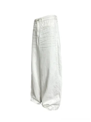 Crisp white pleated wide-leg balloon cotton trousers front flat lay showing relaxed streetwear silhouette