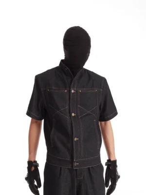 Cropped black stand-collar short-sleeve denim jacket with contrast stitching dual chest pockets and structured utility panel details