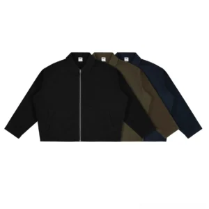 Front flat lay of a multi-color cropped canvas boxy jacket with full metal zipper, workwear collar, and slanted welt pockets