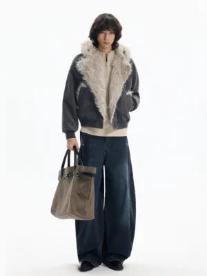 Dark gray cropped faux fur bomber jacket styled with wide leg jeans leather shoes and tote bag in a streetwear outfit