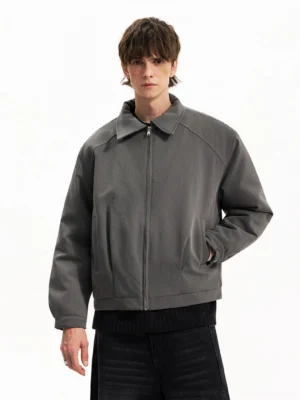 Charcoal gray cropped minimalist Harrington jacket styled with dark wide-leg denim in a Seoul streetwear outfit front view