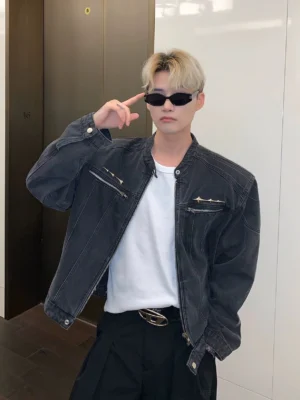Black cropped stand collar washed denim moto jacket front view with metal zip chest pockets