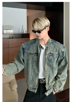 Distressed blue cropped stand collar washed denim moto jacket side view with zip chest pockets