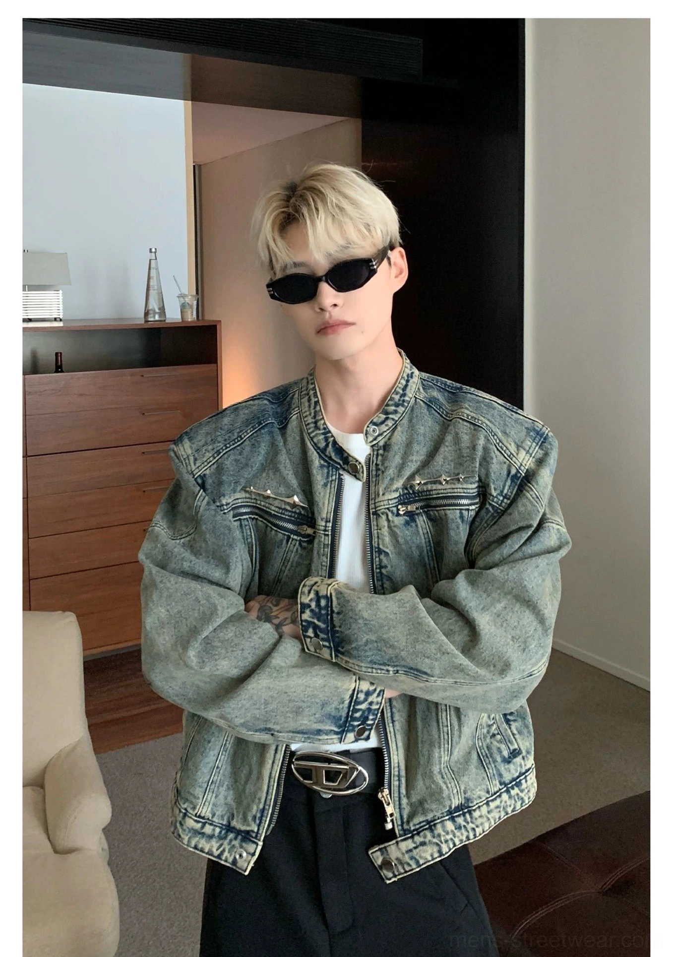 Cropped stand collar washed denim moto jacket showing vintage wash texture and embroidered chest details