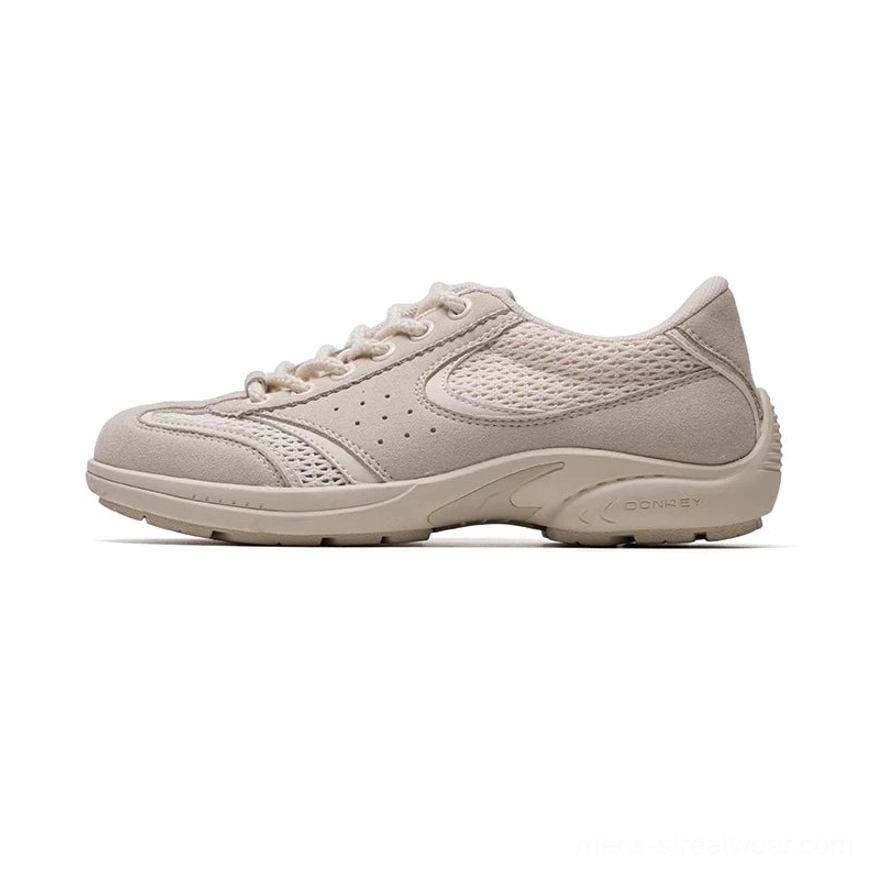 Beige CurveLine retro court sneakers with suede-feel overlays, breathable mesh panels, and neutral rubber sole
