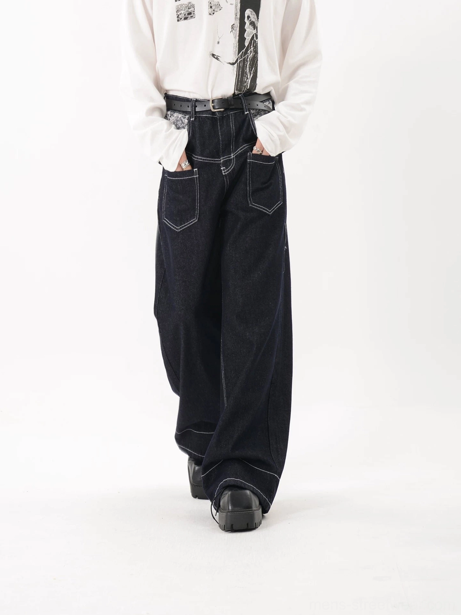 Dark blue baggy wide leg jeans with contrast stitching and front utility patch pockets in streetwear styling