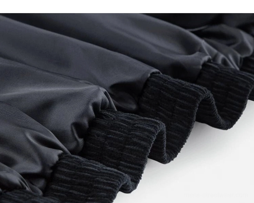 Dark blue corduroy Harrington jacket with understated texture and versatile styling for contemporary city wear