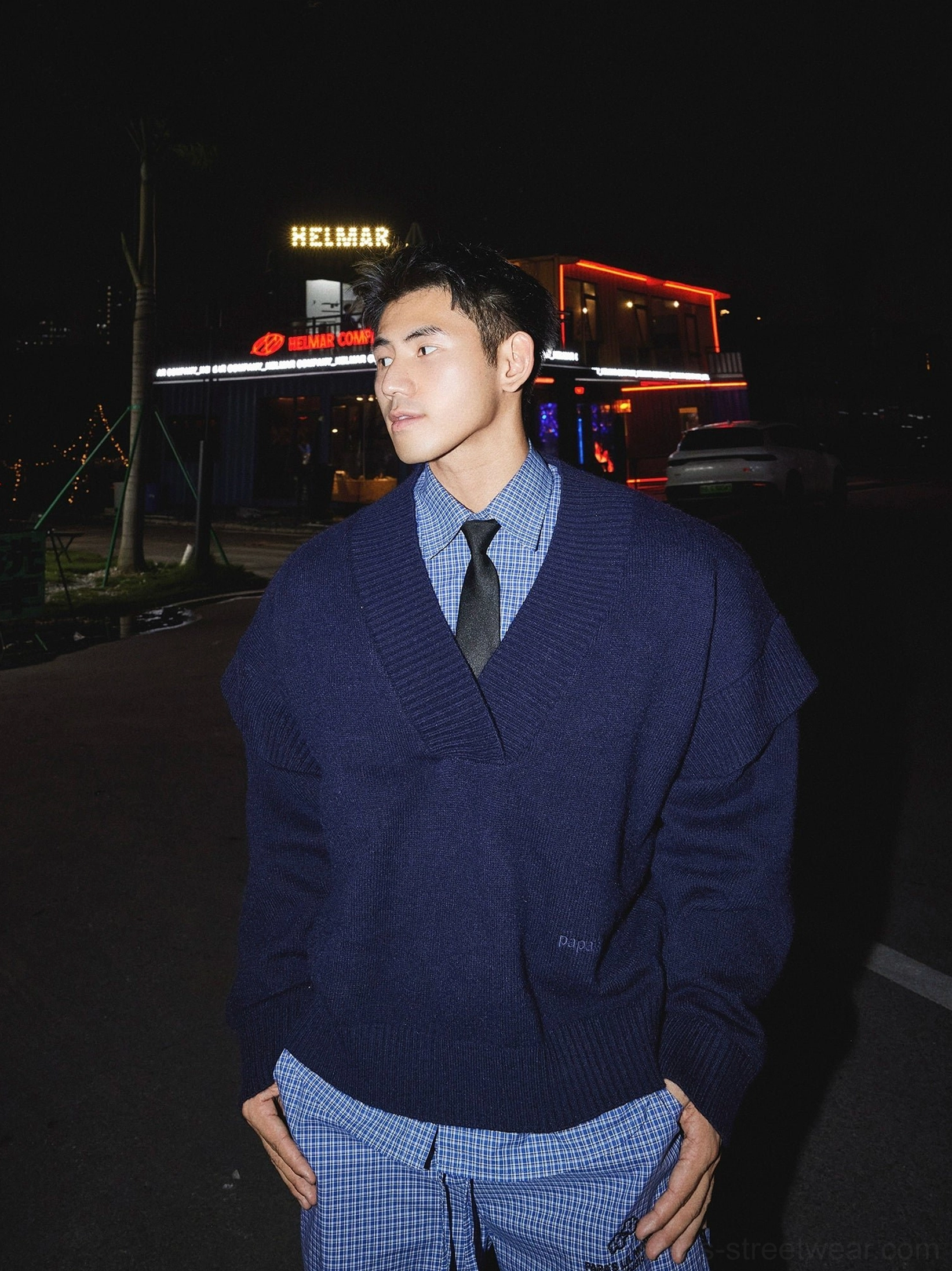 Dark blue oversized deep V-neck knit sweater with checked shirt and black tie in Korean preppy streetwear outfit