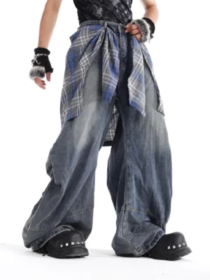 Three-quarter view of relaxed fit dark blue plaid waist panel jeans with exaggerated baggy wide leg silhouette for Korean streetwear outfits
