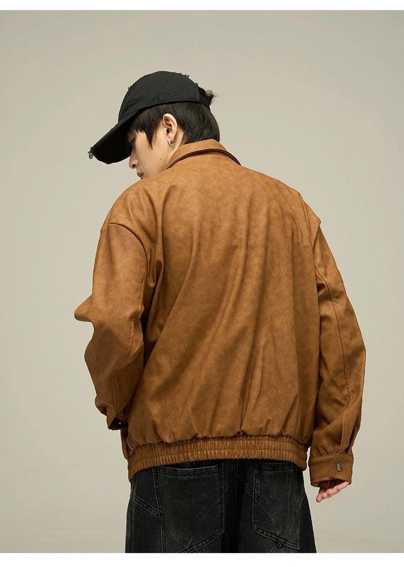 Back view of a dark brown oversized faux leather streetwear jacket showing the relaxed drop-back fit, elasticated ribbed hem, and classic collar silhouette