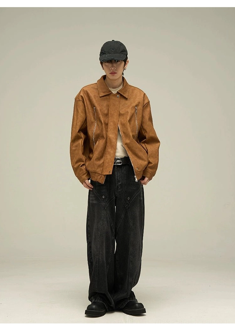 Full body styling view of a dark brown suede-effect faux leather jacket with oversized streetwear fit, black loose jeans, beige tee, and baseball cap