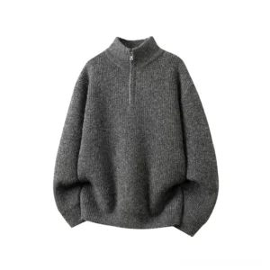 Dark charcoal oversized half-zip mock neck knit sweater with vertical ribbed texture and metal zipper minimalist streetwear design