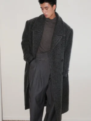 Men's dark gray bouclé wool oversized double-breasted long overcoat in front three-quarter view with peak lapels