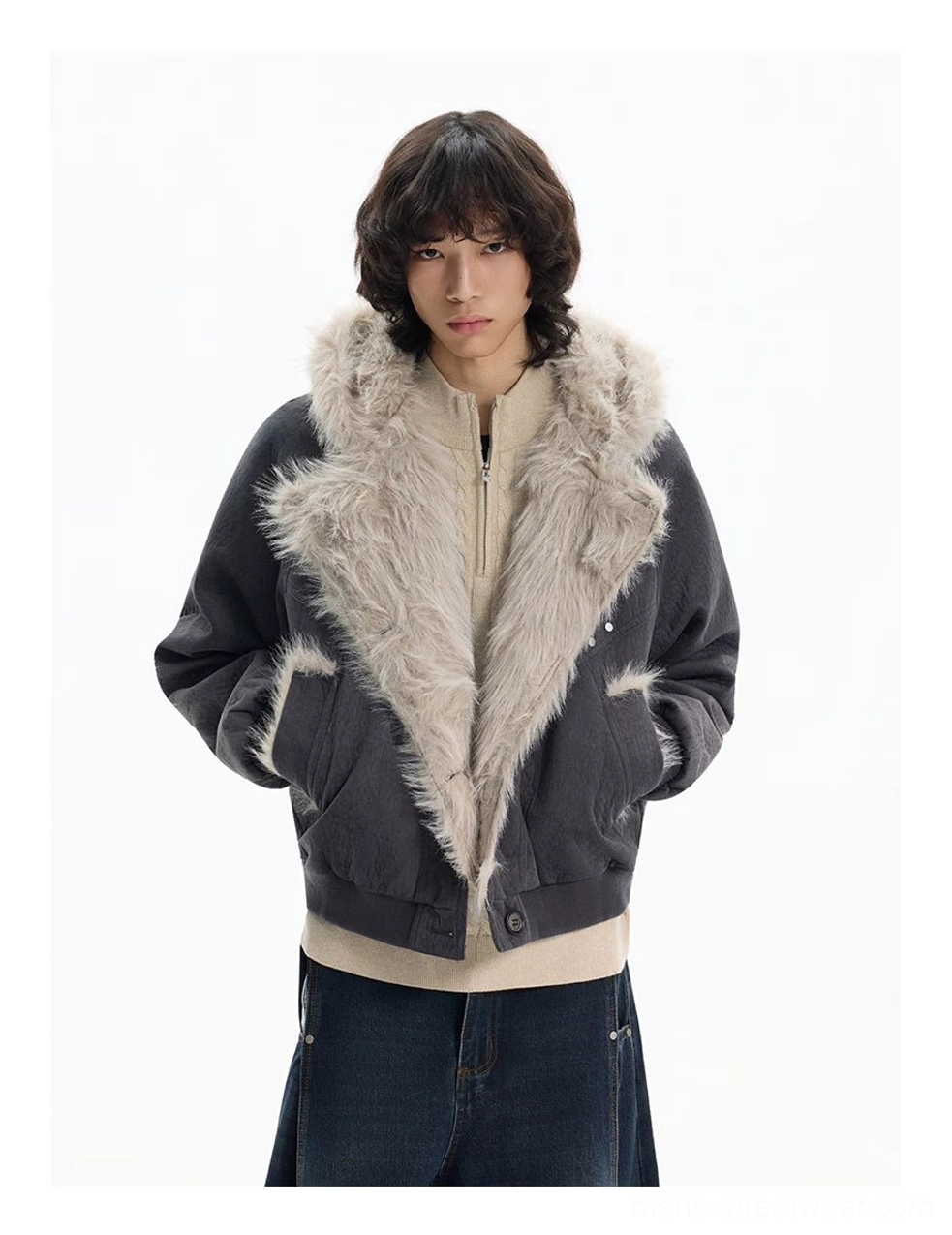 Dark gray cropped faux fur bomber jacket with oversized lapel styled over layered streetwear clothing