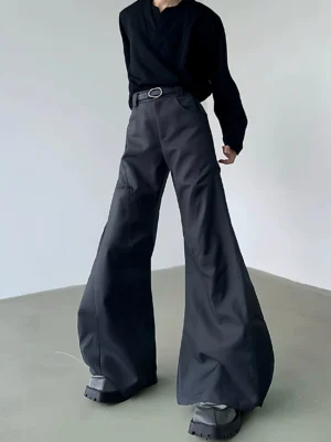 Dark gray high-waisted cargo flare trousers with curved wide-leg panels, side utility pocket, matte workwear fabric, and chunky boots