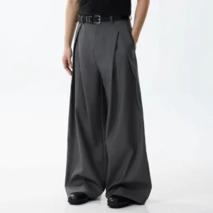 Dark gray oversized wide-leg dress trousers with front pleats, high waist, leather-look belt, and Korean streetwear tailoring