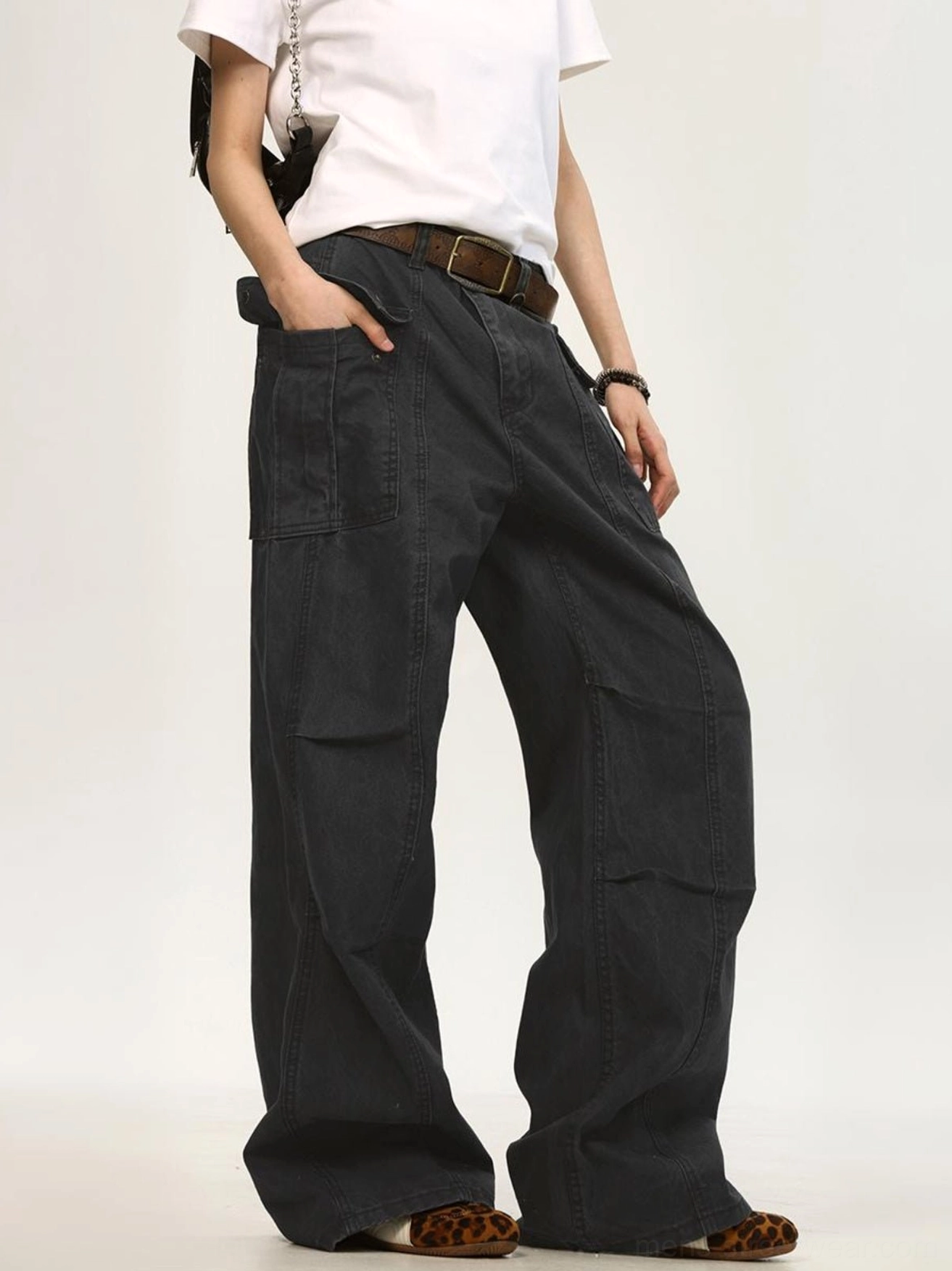Dark gray relaxed wide leg cargo pants with canvas texture seam details and buttoned cargo pocket
