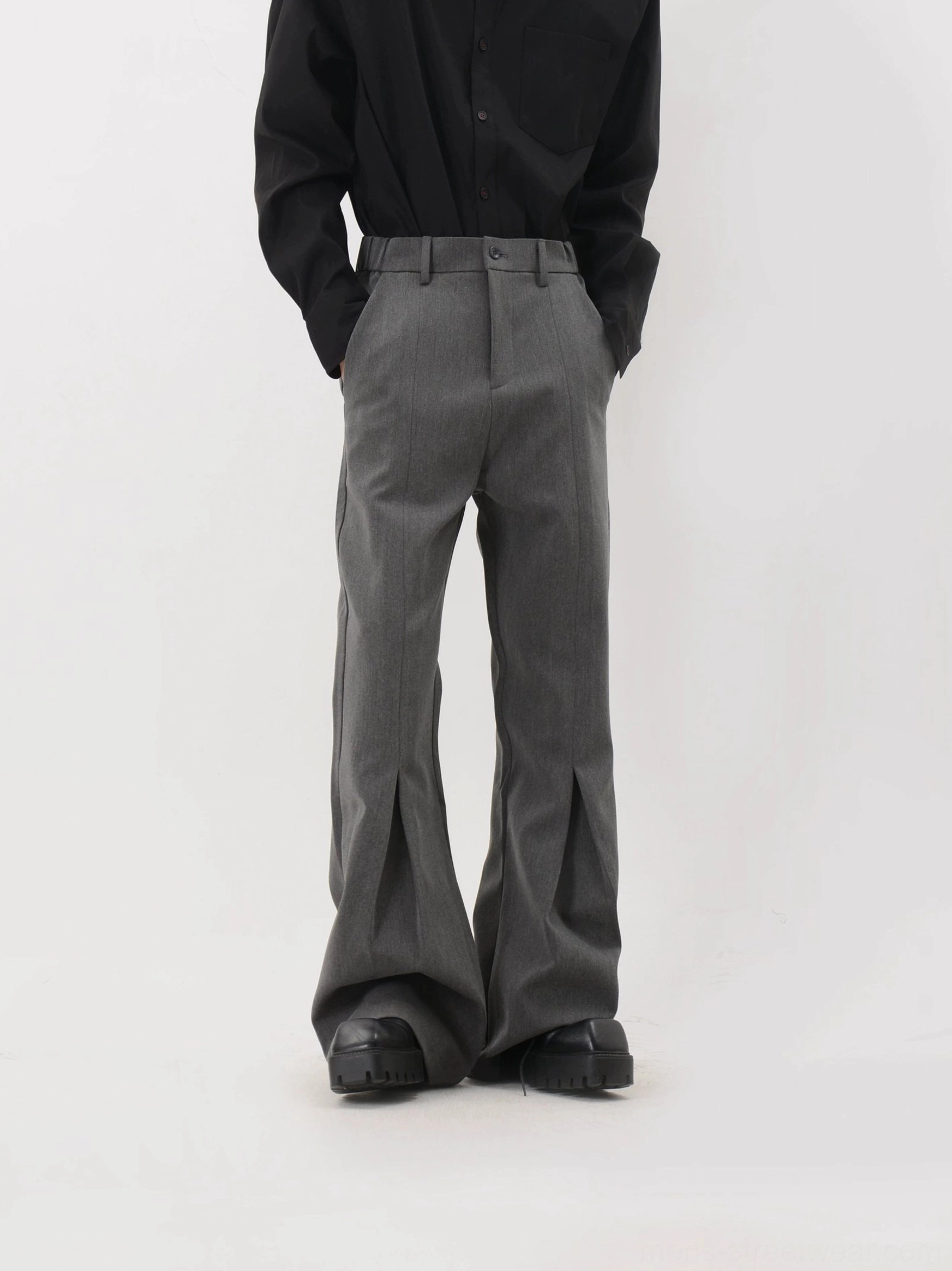 Dark heather gray sculpted crease flare trousers side angle with tailored waist and platform shoe styling