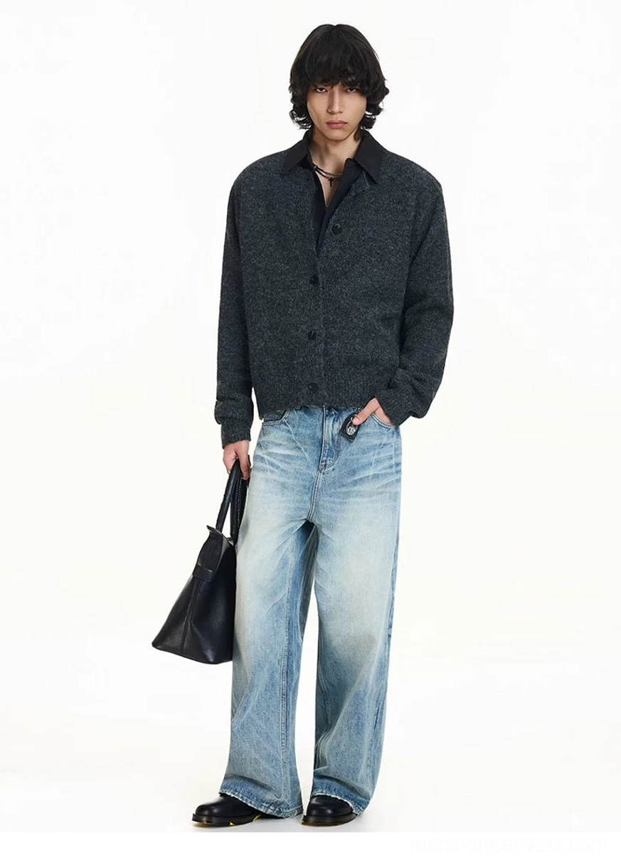 Side view of a dark gray soft knit cardigan showing relaxed drape clean silhouette and contrast collar streetwear styling