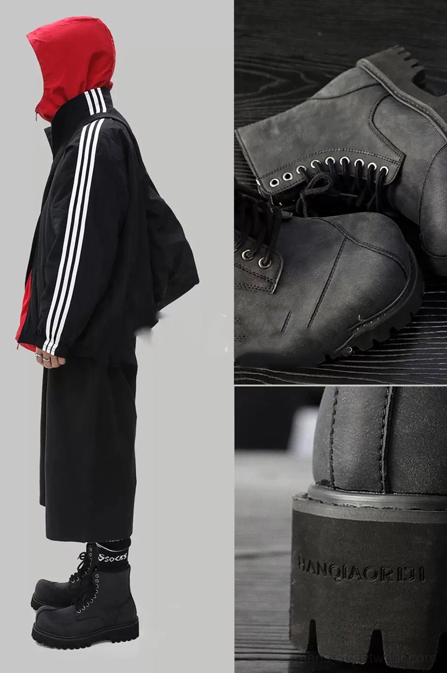 Dark gray suede lug sole combat boots styled with wide-leg black pants in an urban streetwear outfit