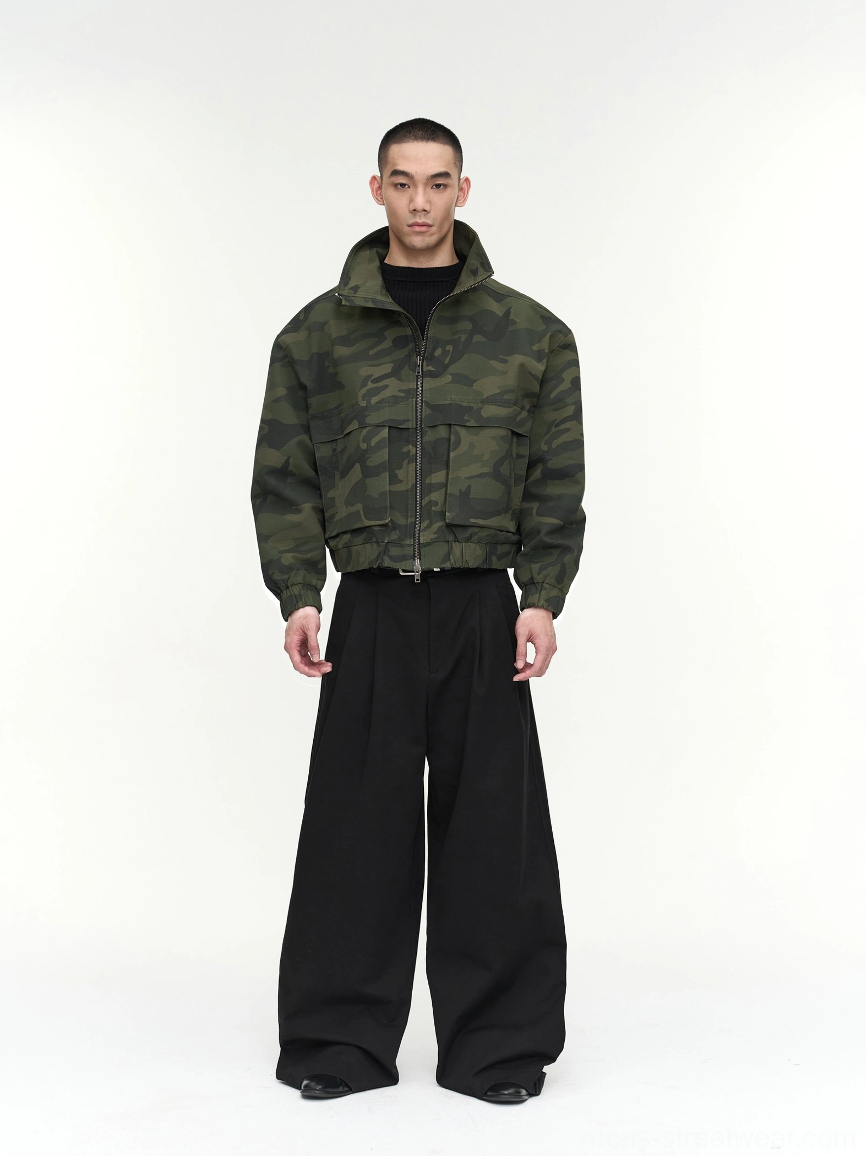 Dark green camouflage men's cropped utility jacket with full front zipper, high stand collar, and ribbed cuffs