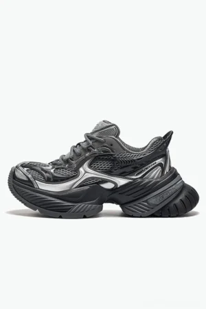 Right side profile of dark grey and black chunky mesh platform sneakers with silver accents and layered rugged outsole