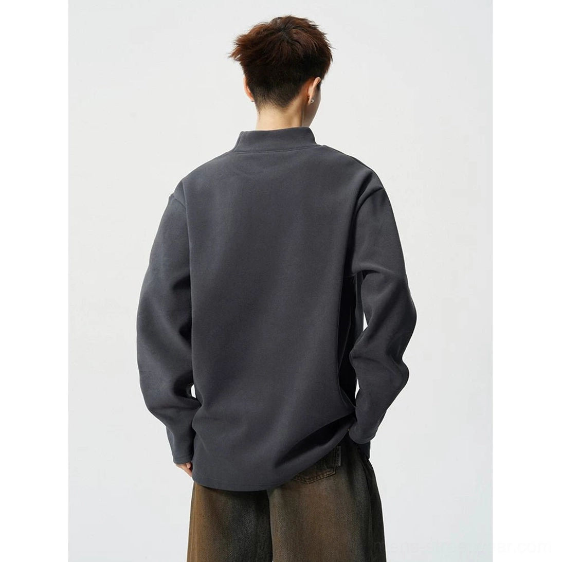 Dark grey boxy mock neck fleece top shown from the back with clean minimalist streetwear construction