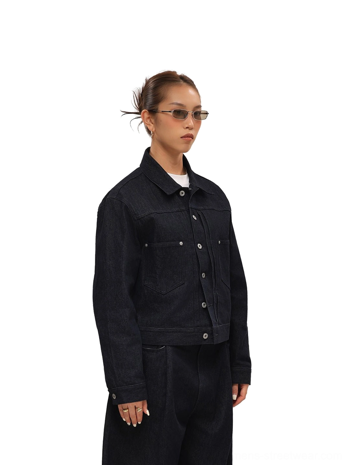 Model wearing dark indigo cropped denim trucker jacket with matching wide-leg denim pants
