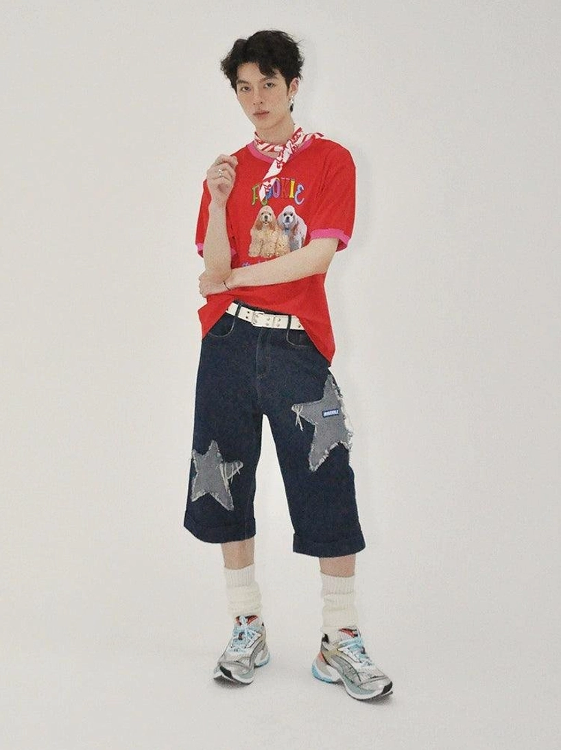 Dark indigo denim culottes with graphic star patches and cropped wide legs, suitable for layered Japanese inspired streetwear looks