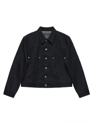 Dark indigo non-fade cropped denim trucker jacket front flat lay with metal buttons and chest pockets