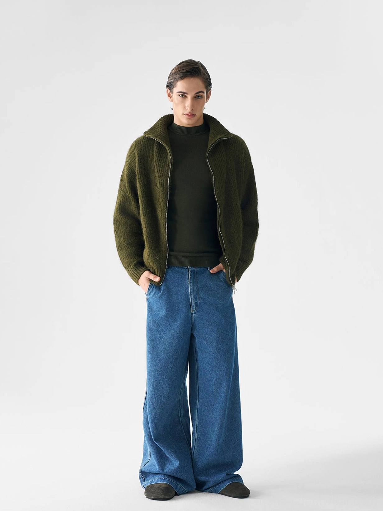 Dark olive green textured ribbed zip knit sweater for men styled with wide-leg jeans in a relaxed Seoul fashion outfit