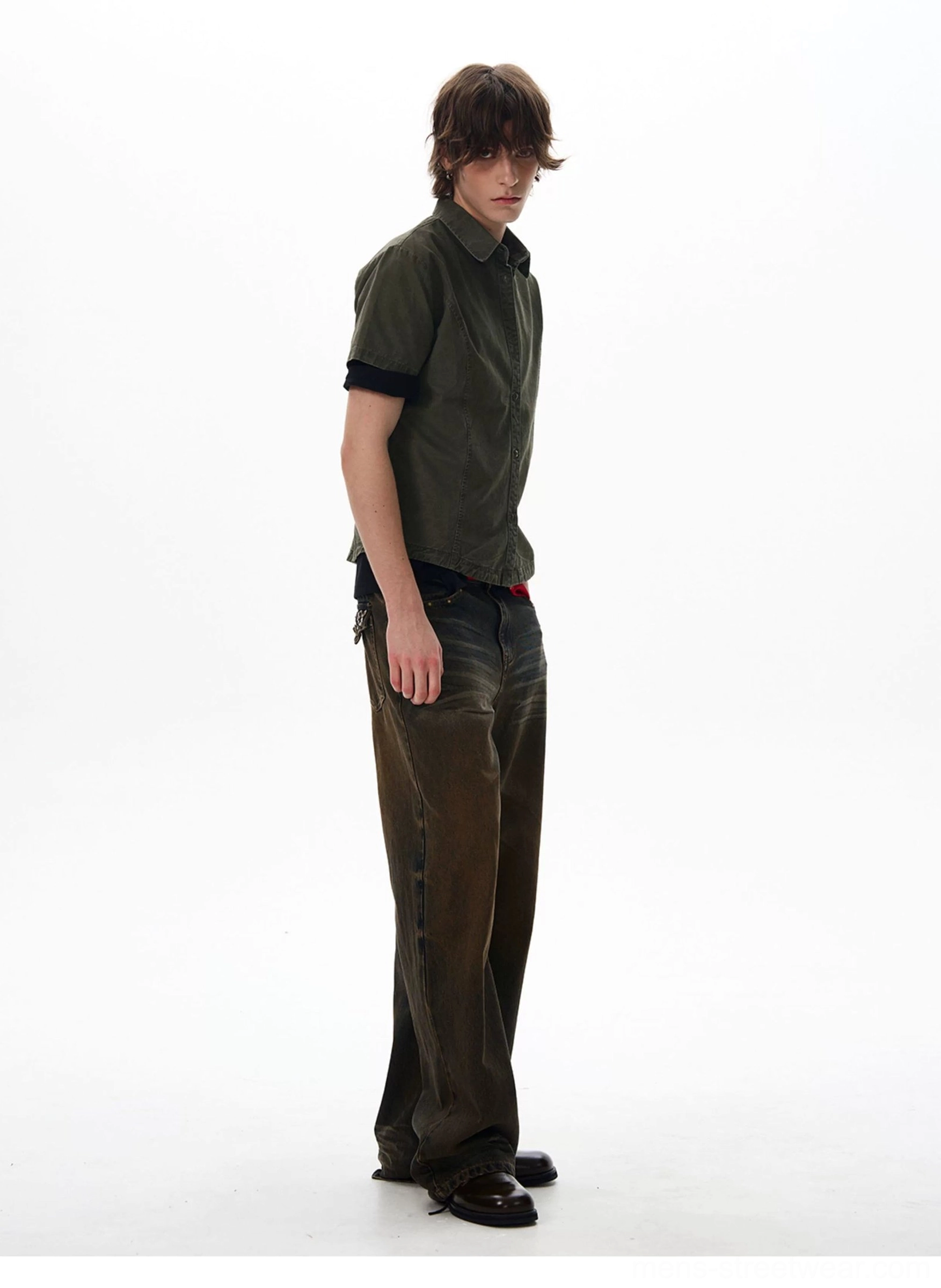 Side view of dark olive green short sleeve utility work shirt with relaxed Korean streetwear fit