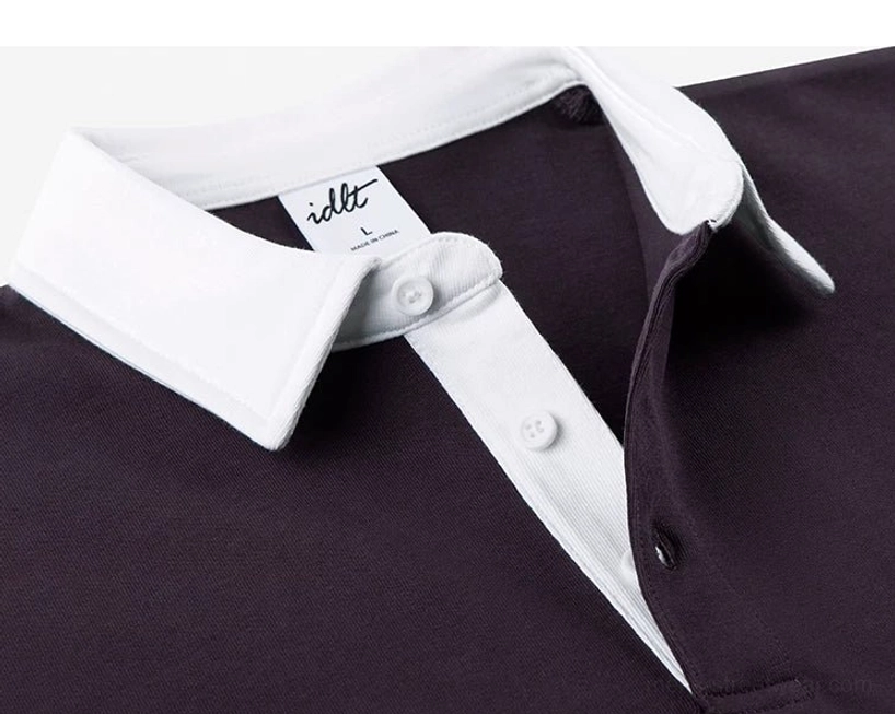 Dark purple knit polo shirt side neckline close-up with white contrast collar button placket and neat stitching