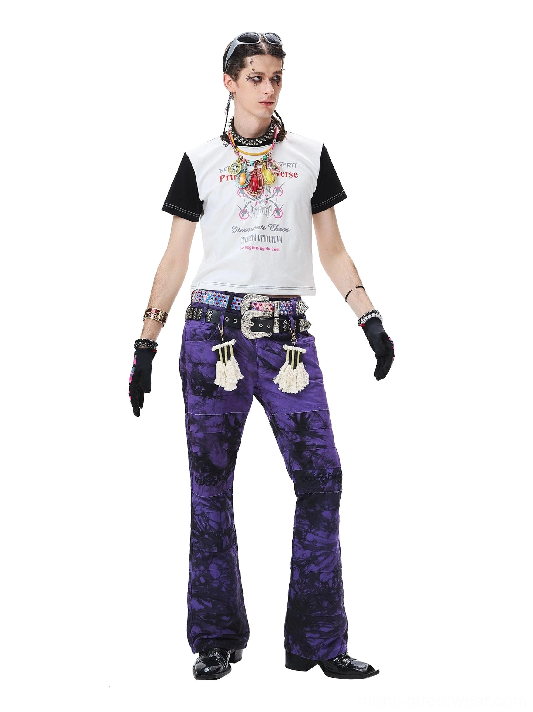 Dark purple wide-leg trousers with black tie-dye pattern, embroidered knee detail, and flared silhouette
