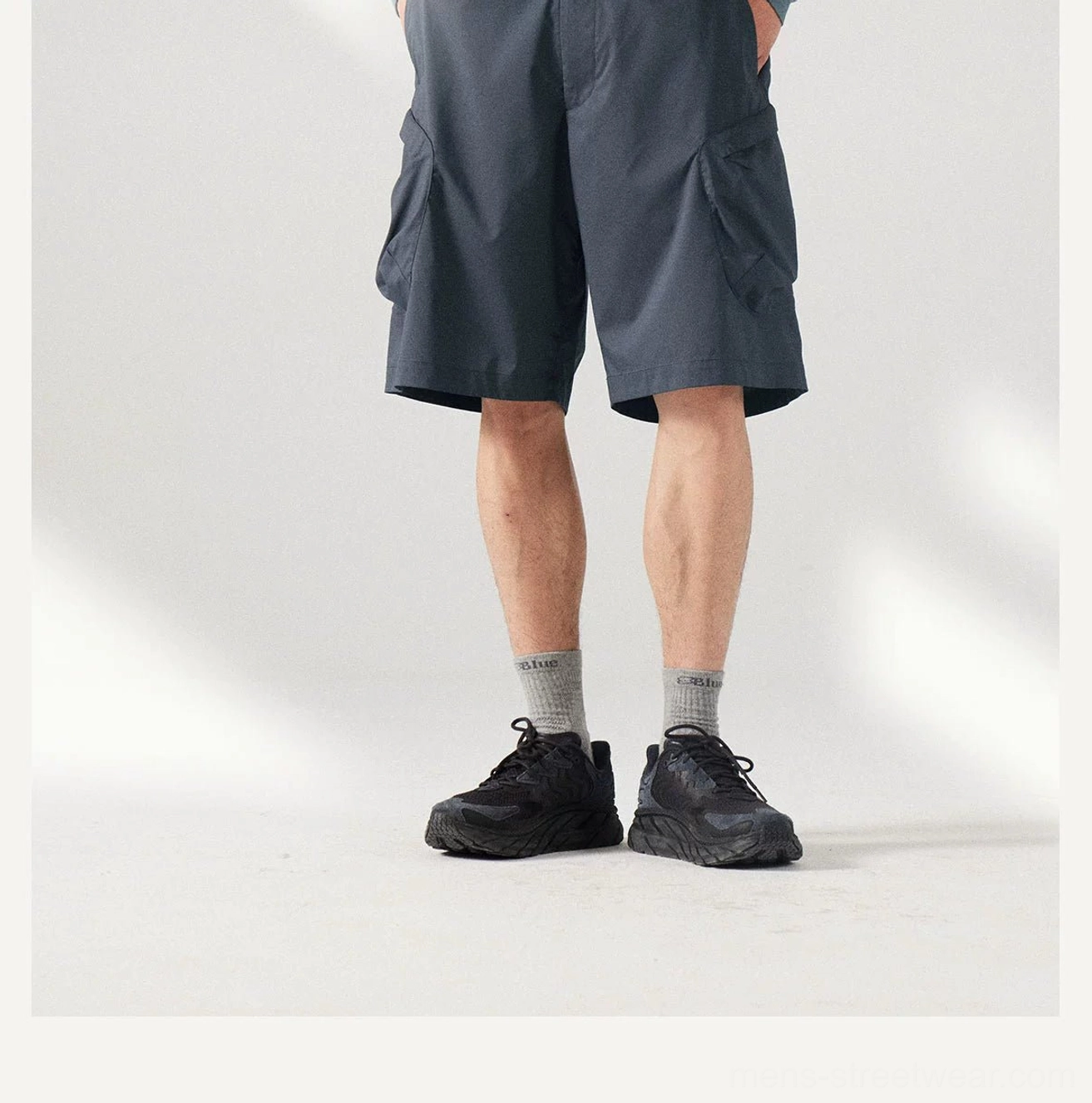 Dark red men's cargo shorts for statement streetwear outfits, featuring a comfortable elastic drawstring waist and loose leg shape